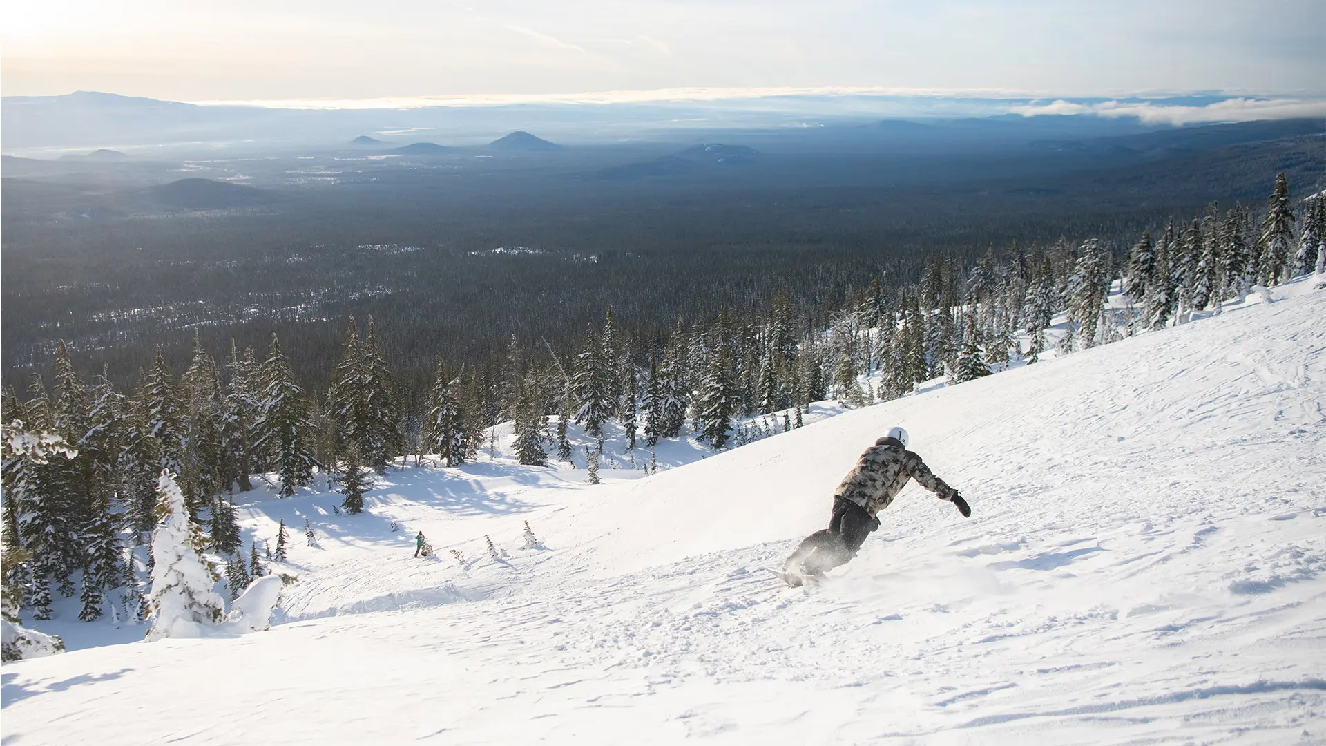 Snowboarder off Cloudchaser lift on Mt. Bachelor