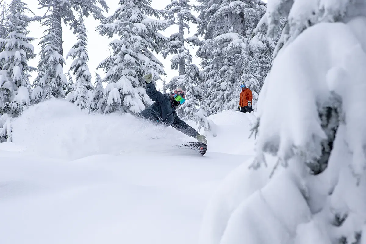 Snowboarders riding powder at Mt. Bachelor