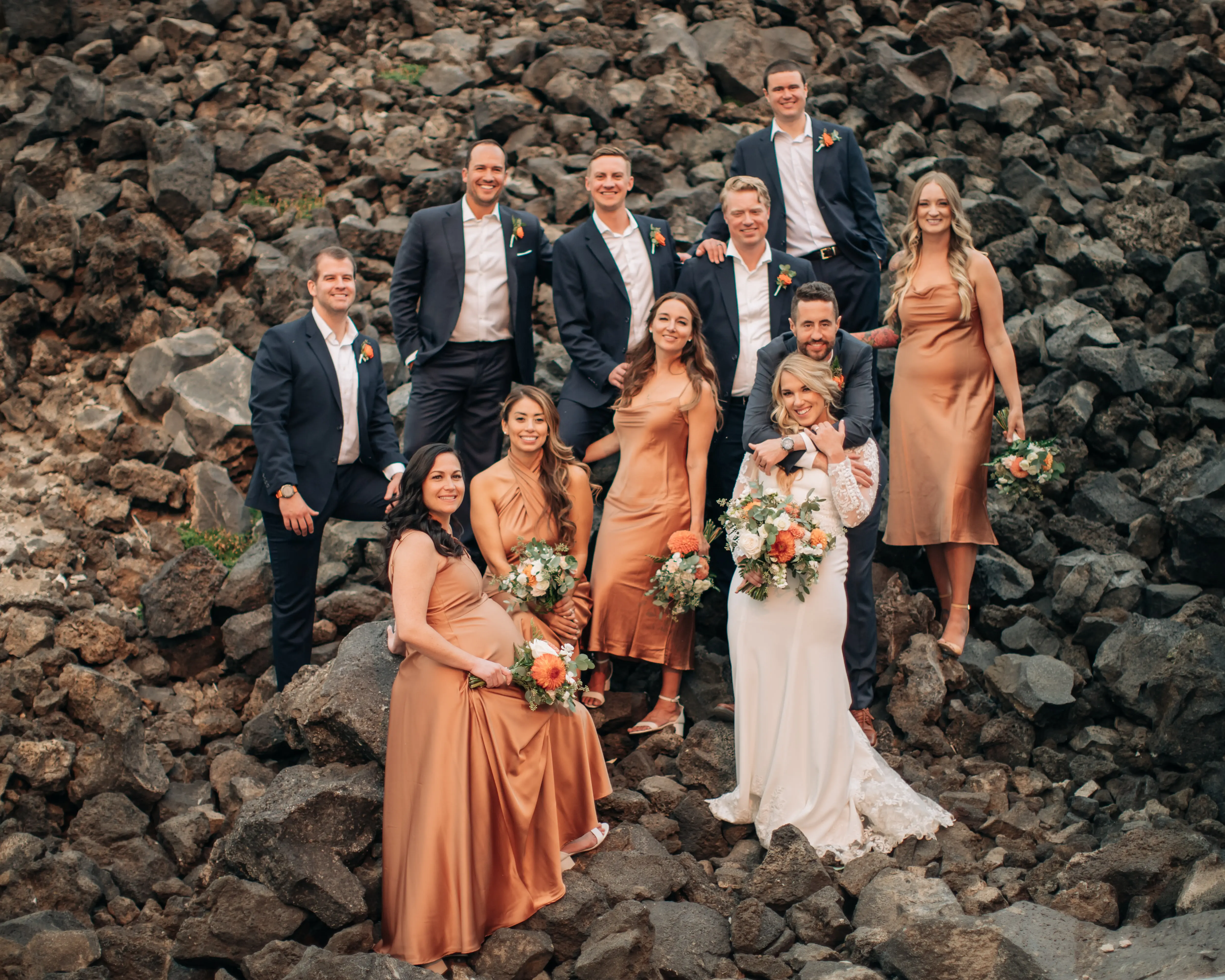 Group of brides, grooms and friends on the lava rock of mt. bachelor near Bend, Oregon.