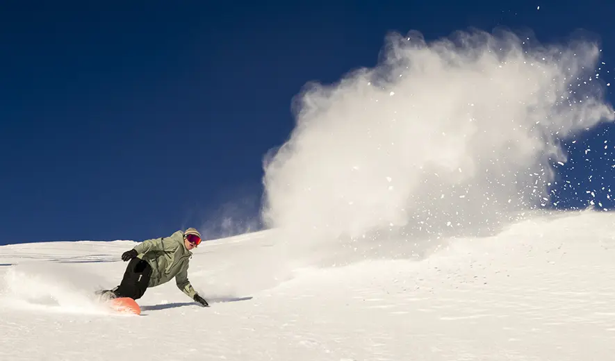 Snowboarder on a bluebird day at Mt. Bachelor