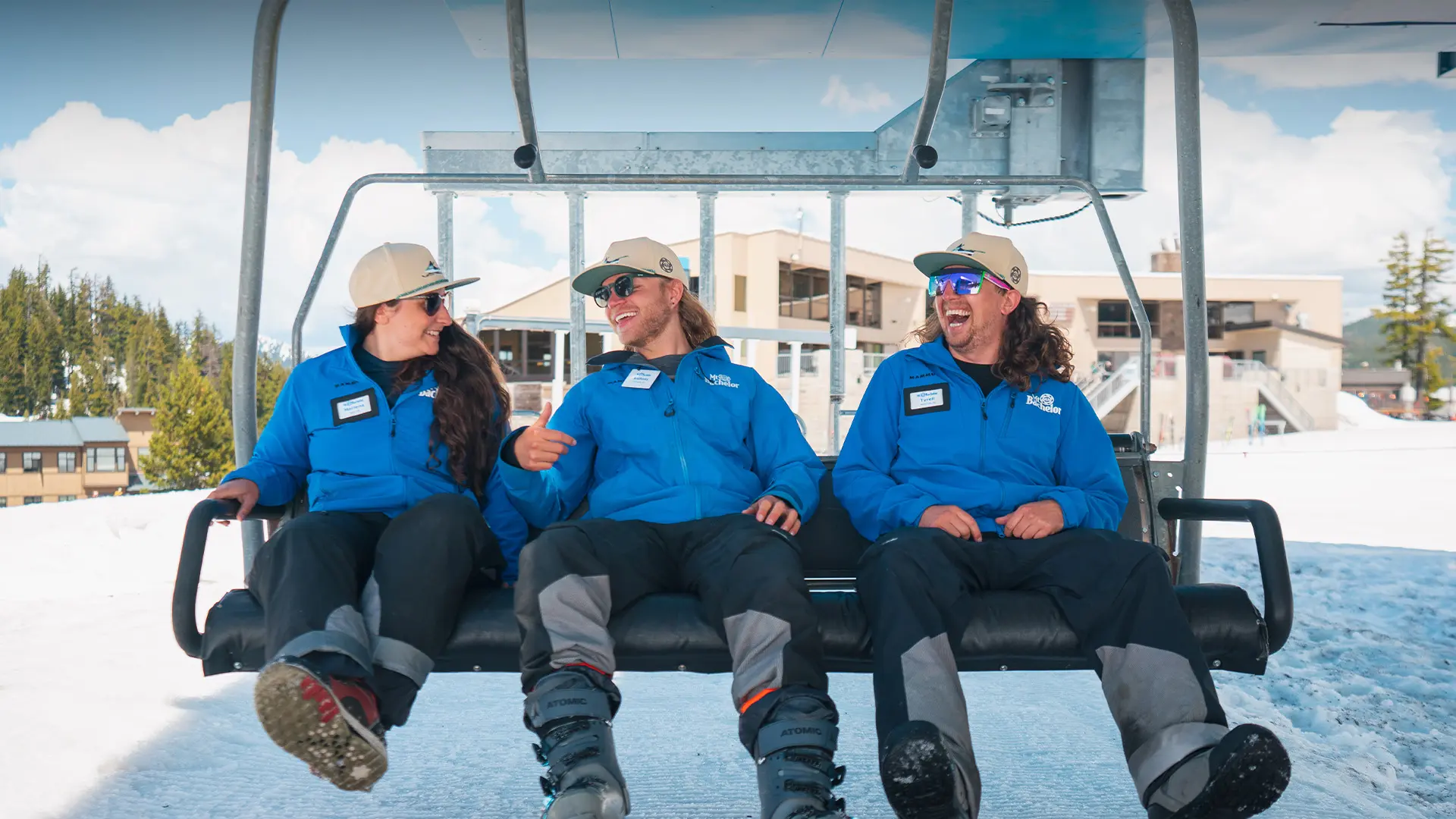 Employees smiling on Pine Marten chairlift