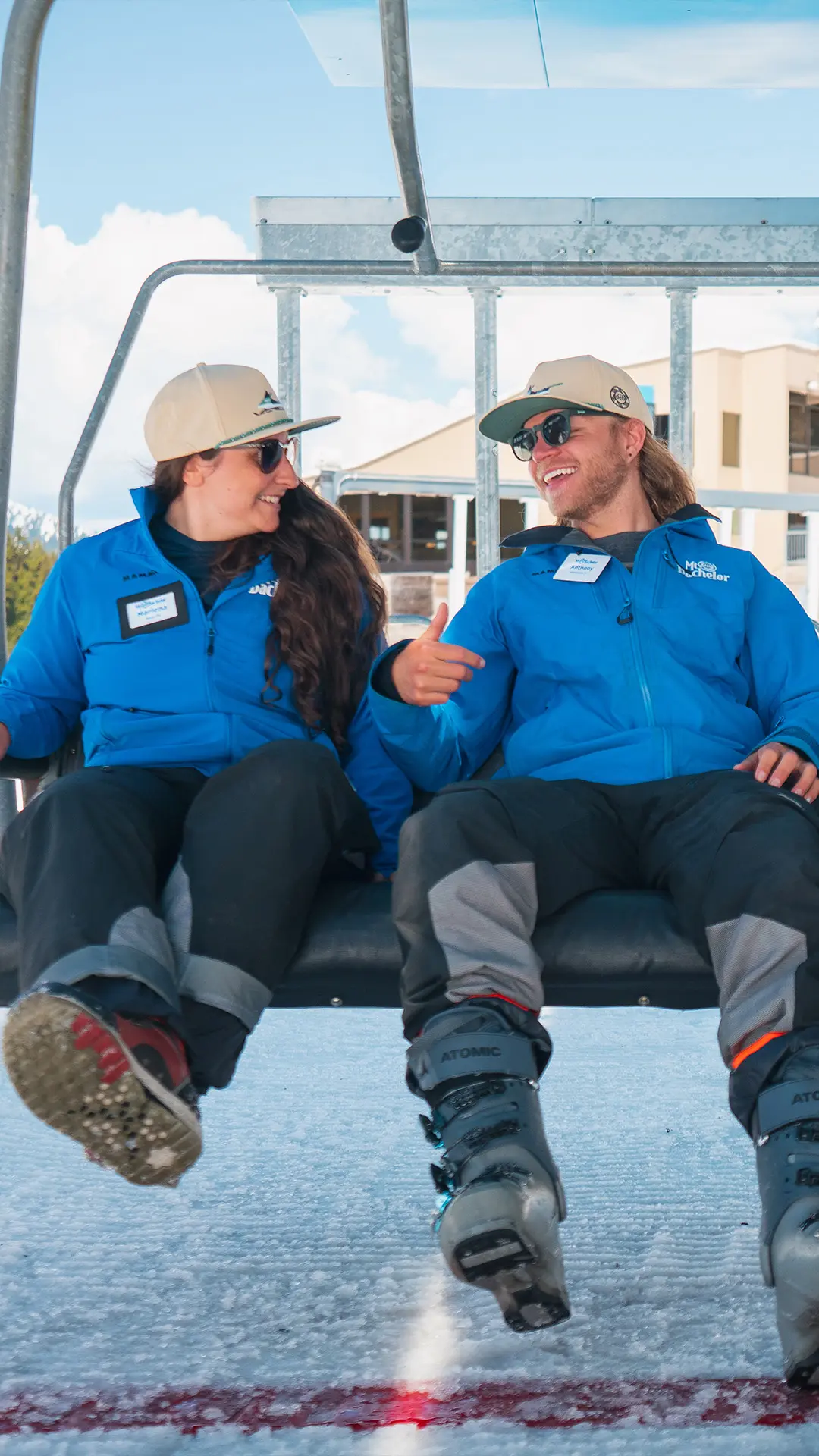 Employees smiling on Pine Marten chairlift