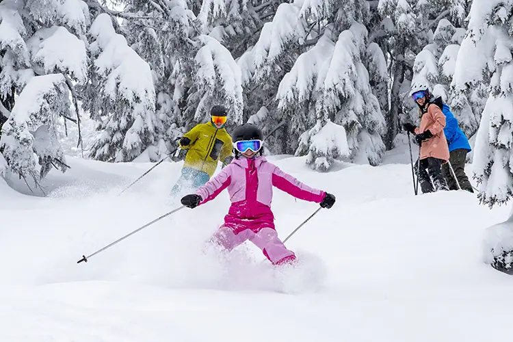 Family skiing powder at Mt. Bachelor in February 2025