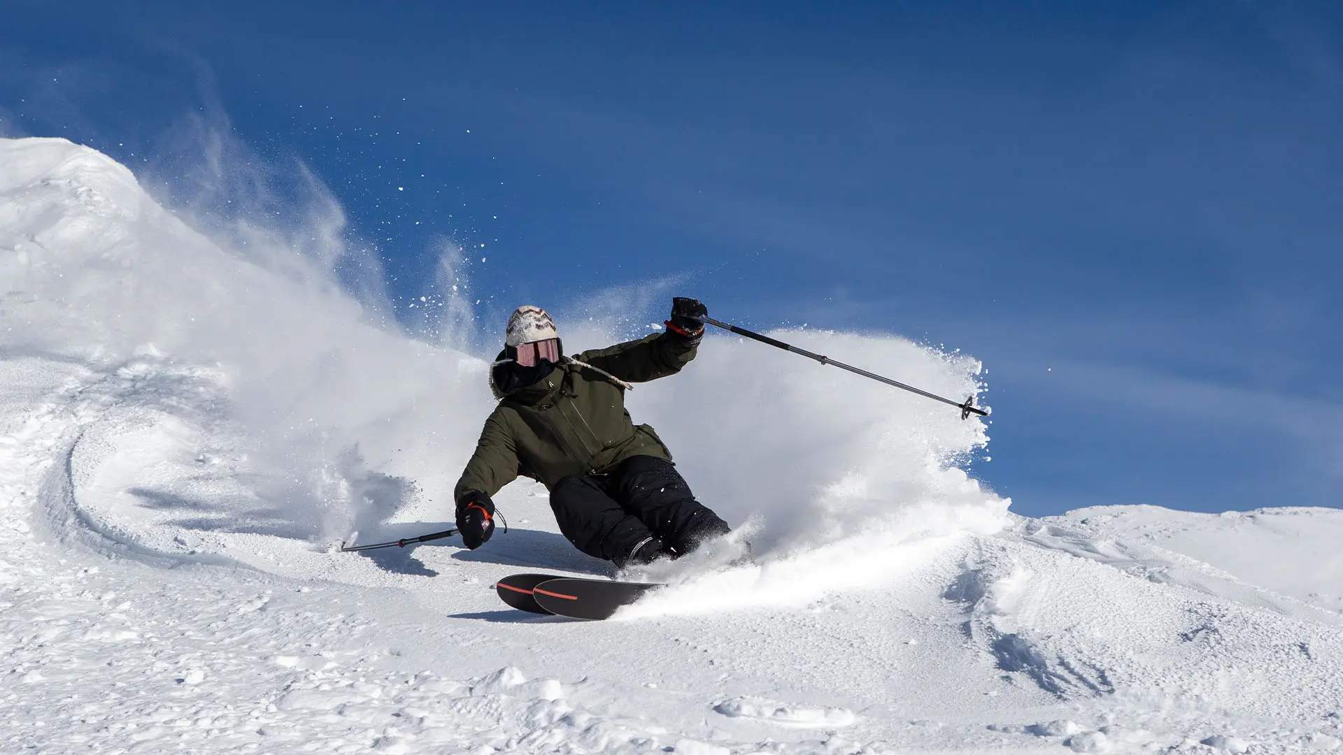 Skier with Fast Tracks getting first access off Summit