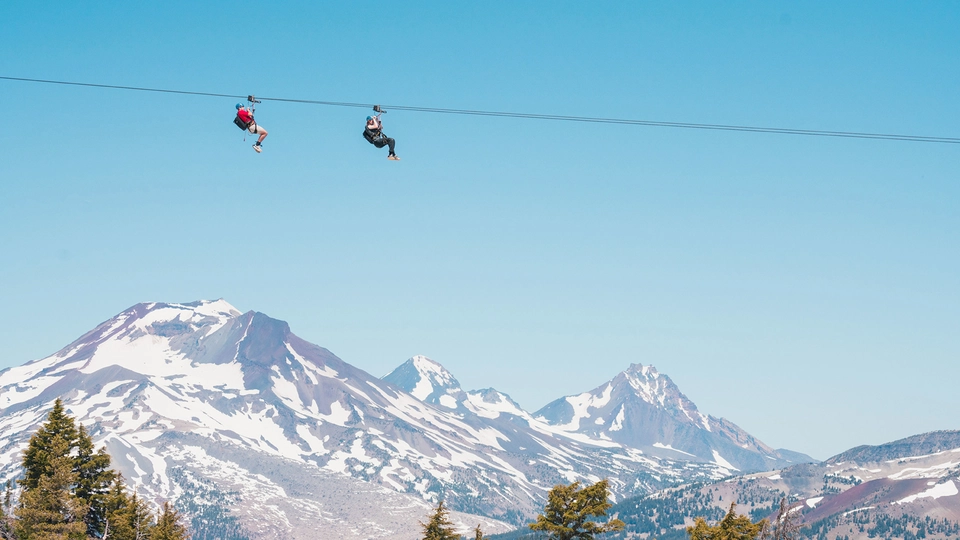 Zip liners soaring about the slopes of Mt. Bachelor
